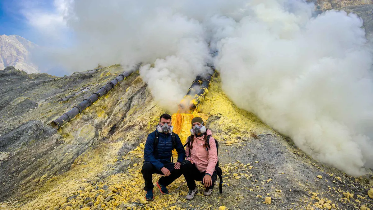Hiker above the clouds at Bromo on a 4-day East Java volcano tour with train travel